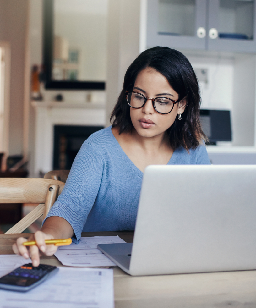 Woman doing financial work using calculator