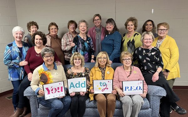 Chapter HR, Kansas, holding You Add to P.E.O. signs