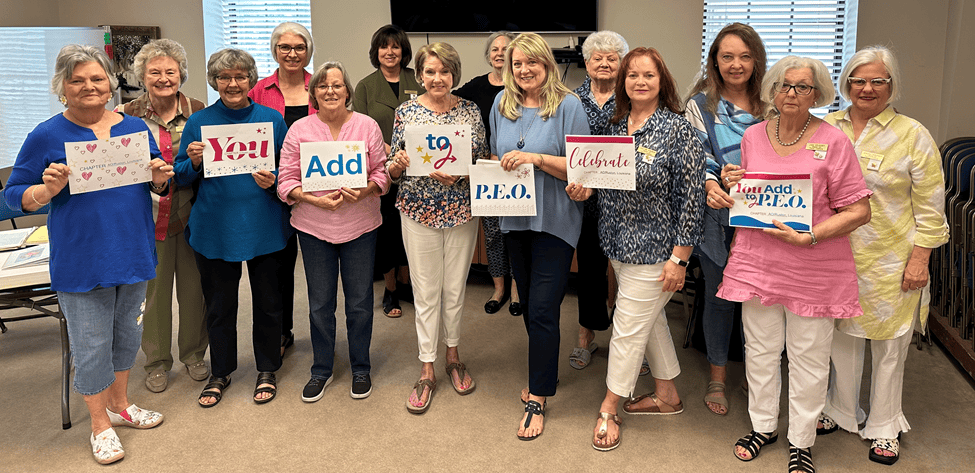 Chapter AO, Louisiana, holding You Add to P.E.O. signs