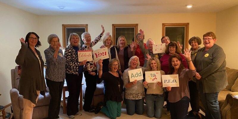 Chapter HX, Rossville, holding P.E.O. signs