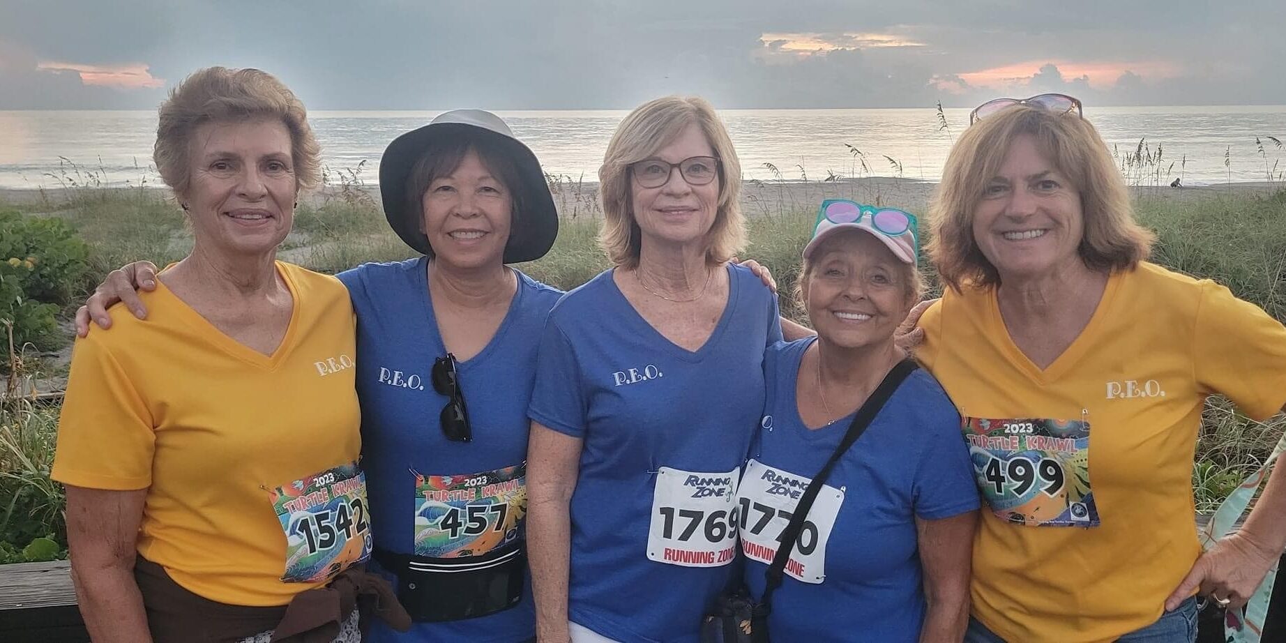 Members of JF, Florida wearing matching shirts