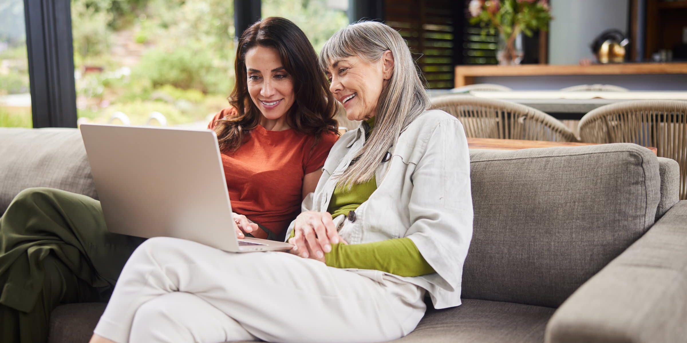Mom and daughter using computer together