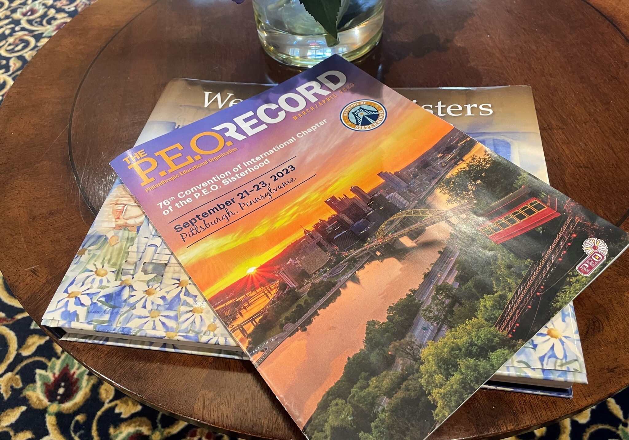 The P.E.O. Record March April 2023 magazine on a table