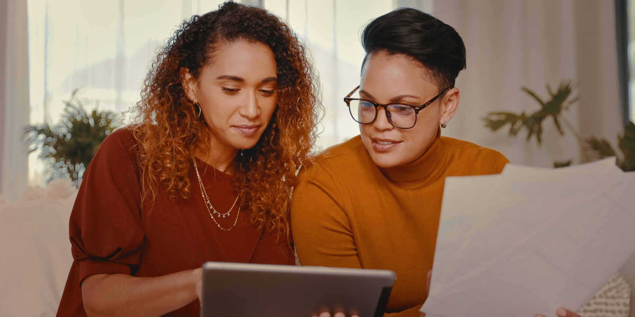 Two women looking at finances together