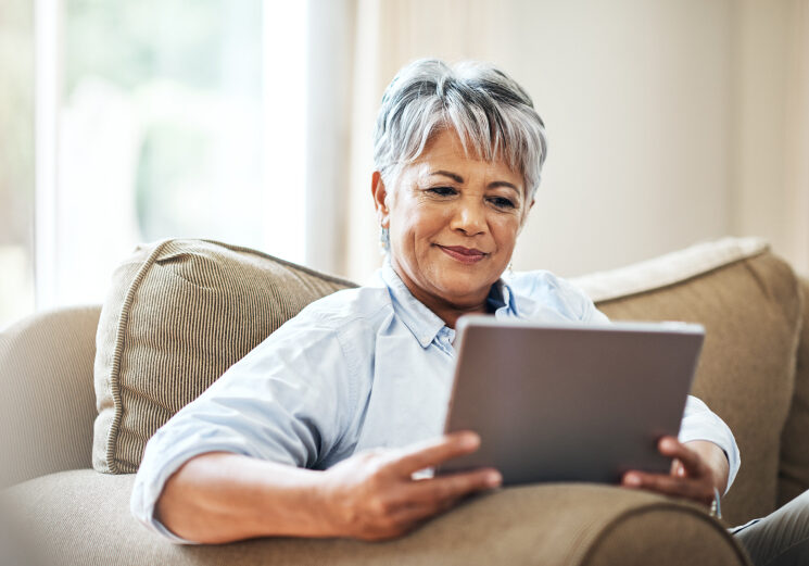 Woman reading news on tablet