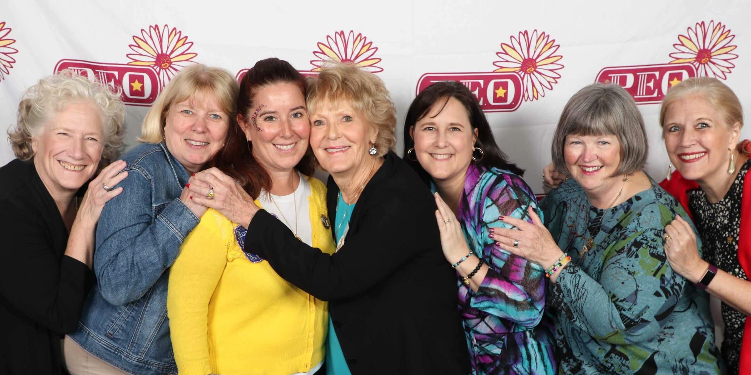 Women hugging at the 2023 Convention of International Chapter